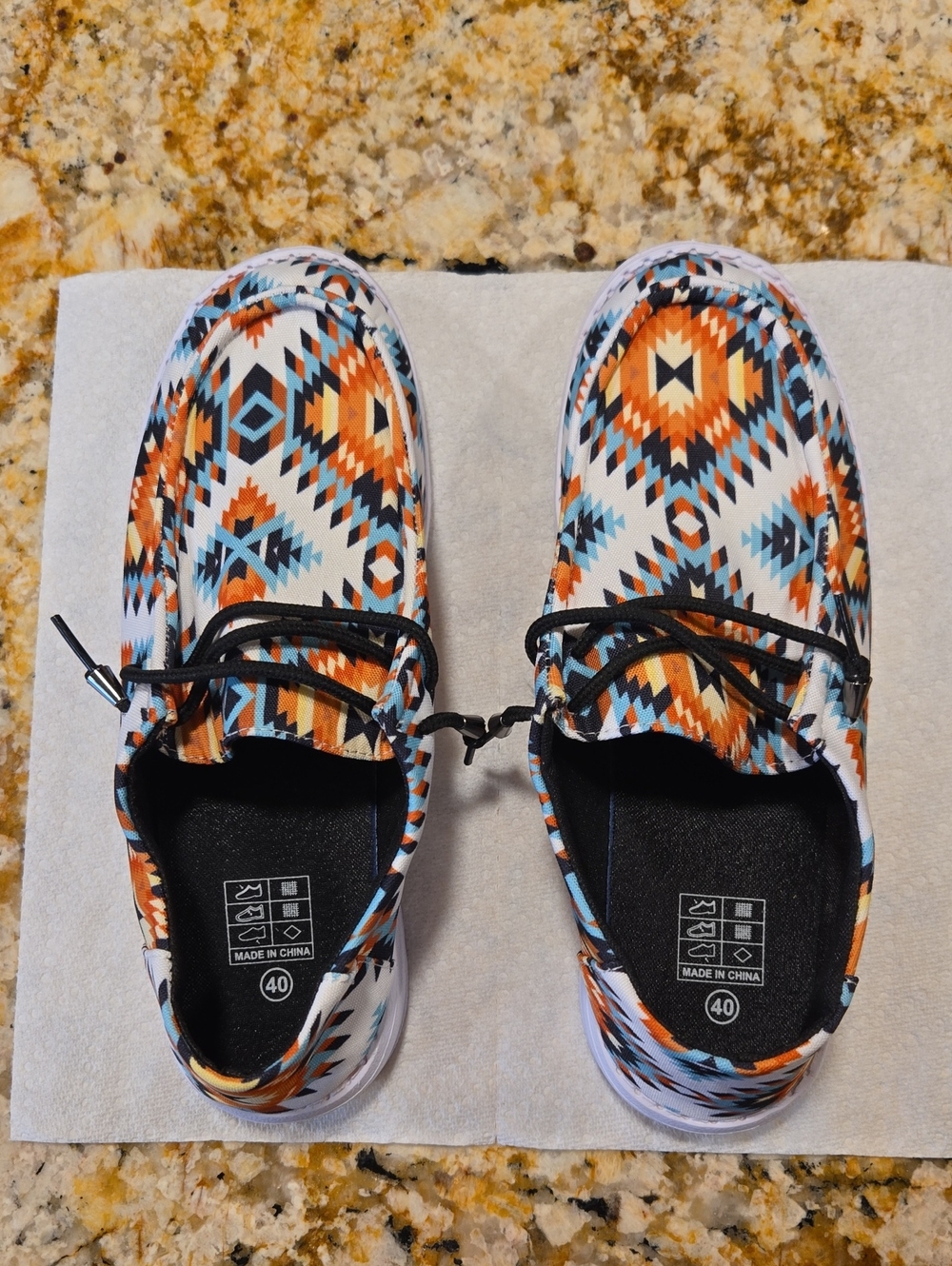 Aztec Print Slip-On Sneakers in Orange, Blue & Black.
